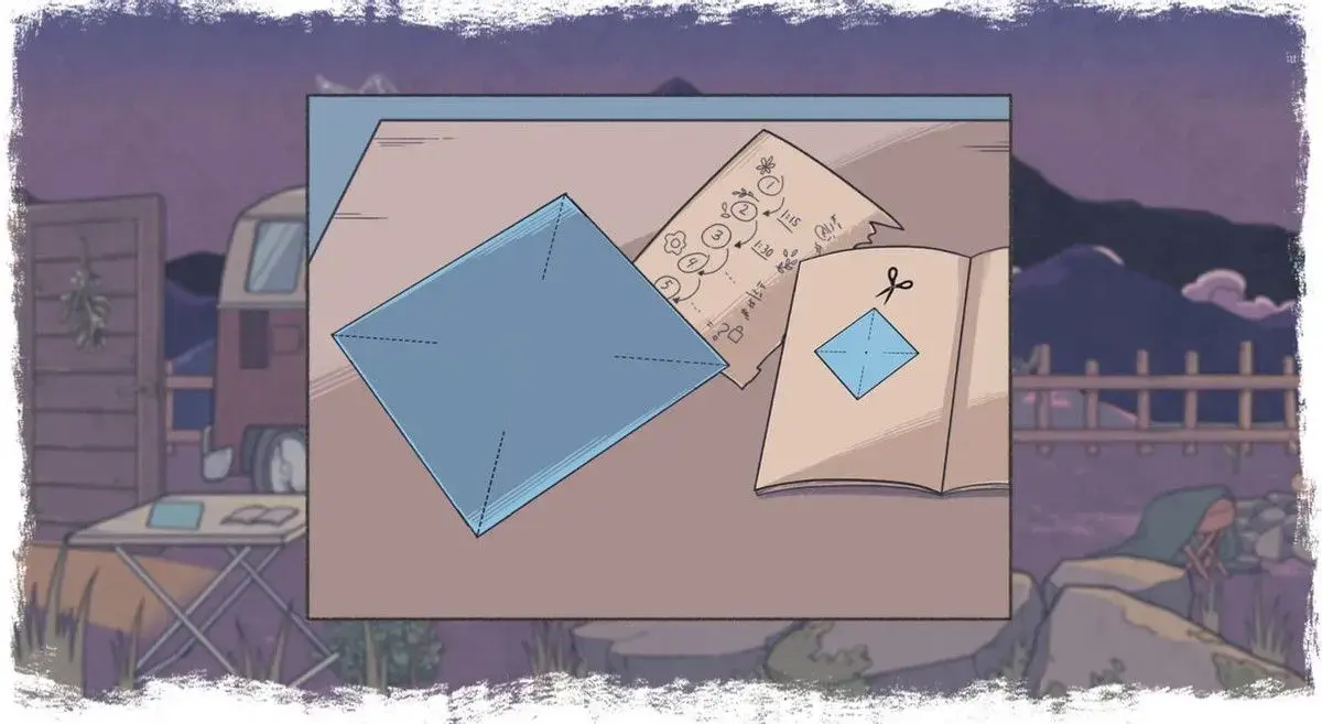 An origami puzzle: the origami paper is on the table next to an origami instruction pamphlet.
